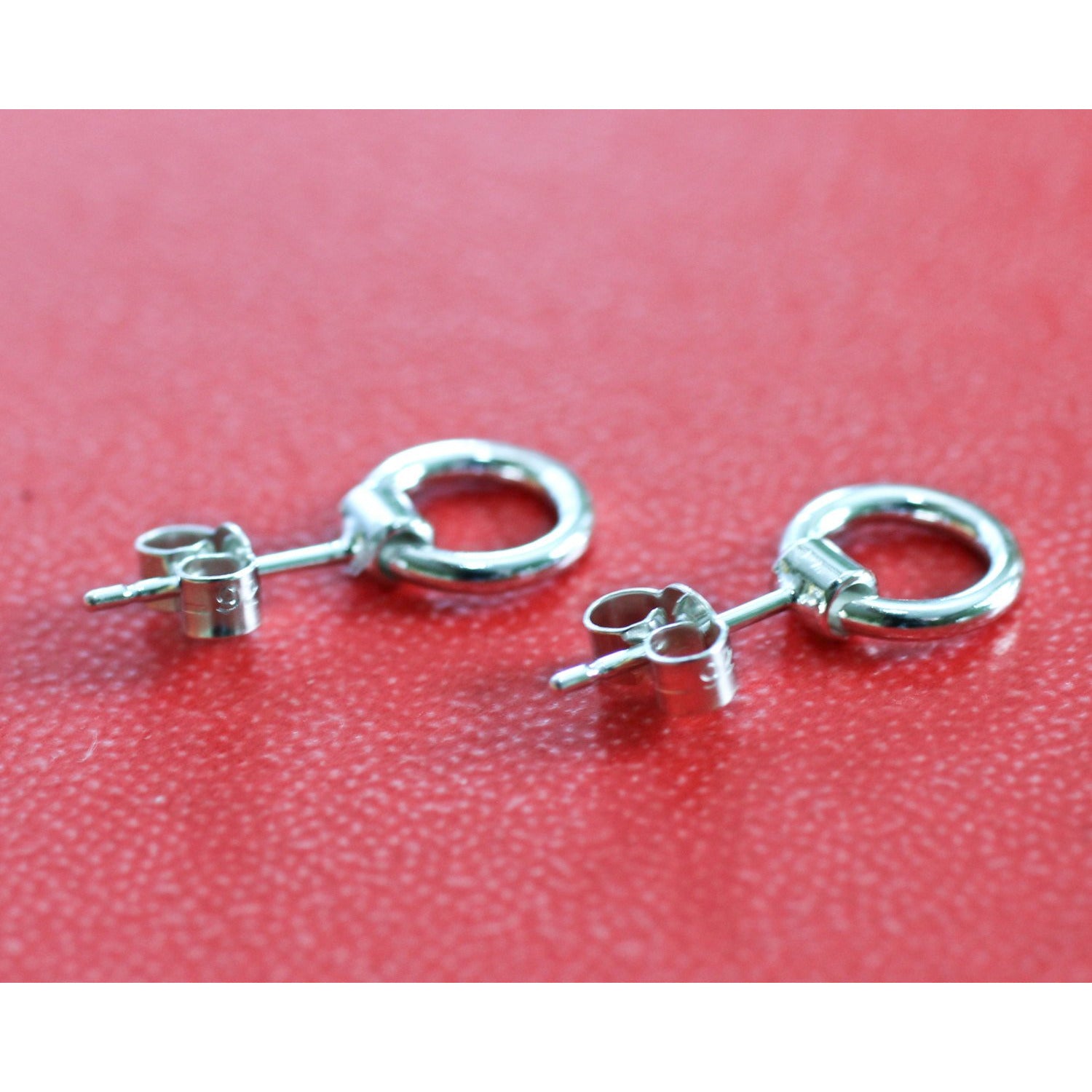 Unique and stylish BDSM earrings: Ring of O shackle studs in sterling silver